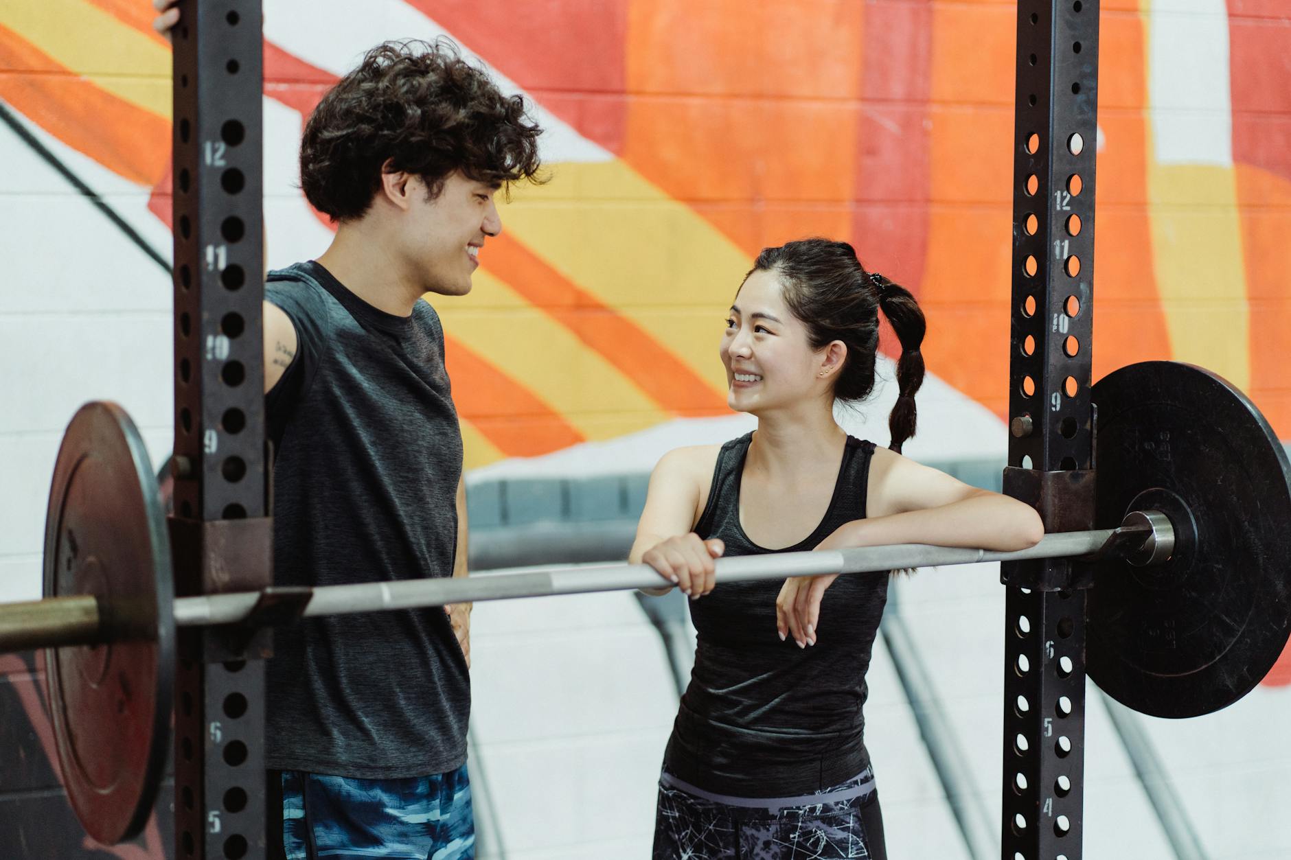 https://www.pexels.com/photo/a-woman-leaning-on-a-barbell-4853709/